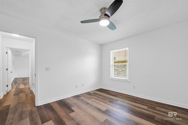 6950 Summerset Dr, Gulf Shores, AL 36542 - empty room featuring dark wood-style flooring, ceiling fan, a textured ceiling, and baseboards