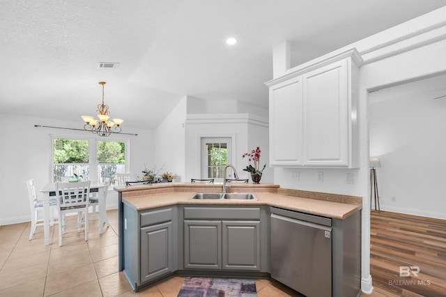 6950 Summerset Dr, Gulf Shores, AL 36542 - kitchen with dishwasher, a sink, a chandelier, gray cabinetry, and white cabinetry