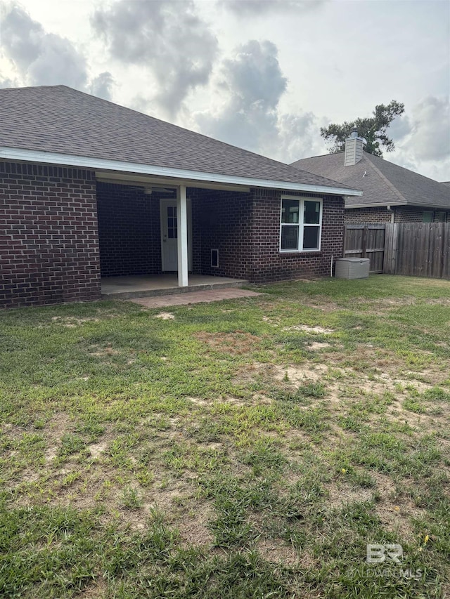 6950 Summerset Dr, Gulf Shores, AL 36542 - rear view of property with brick siding, a patio, and a shingled roof