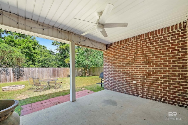 6950 Summerset Dr, Gulf Shores, AL 36542 - view of patio / terrace featuring a fire pit and ceiling fan