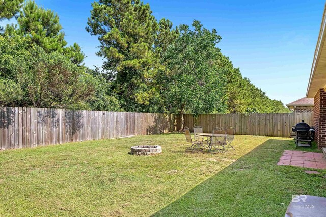 6950 Summerset Dr, Gulf Shores, AL 36542 - view of yard with an outdoor fire pit