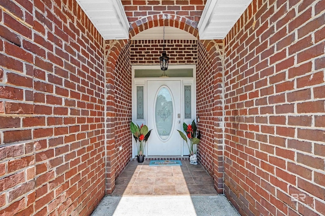 6950 Summerset Dr, Gulf Shores, AL 36542 - view of exterior entry featuring brick siding