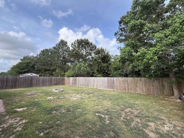 6950 Summerset Dr, Gulf Shores, AL 36542 - view of yard featuring an outdoor fire pit