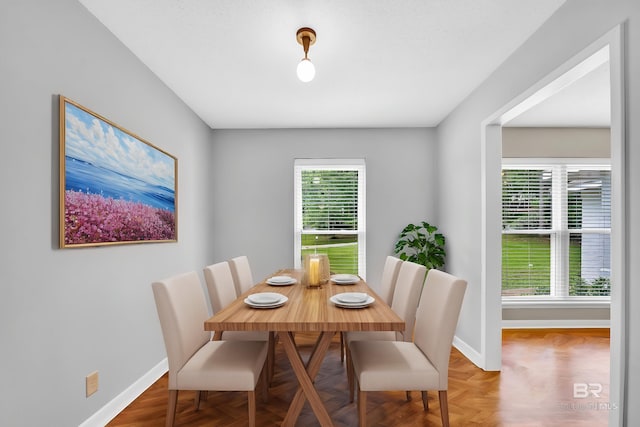 dining area featuring baseboards
