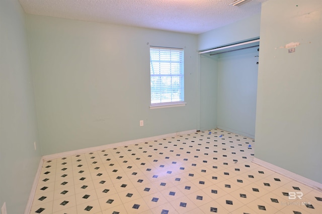 bedroom featuring a closet and a textured ceiling