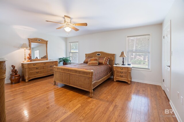 bedroom featuring light hardwood / wood-style floors and ceiling fan