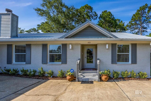 view of front of house with a patio area