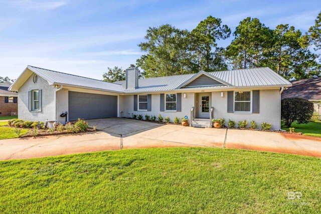 single story home with a garage and a front yard