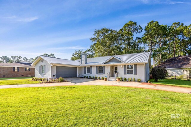 ranch-style home featuring a garage and a front yard