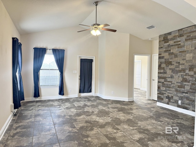 unfurnished room with a ceiling fan, high vaulted ceiling, visible vents, and baseboards