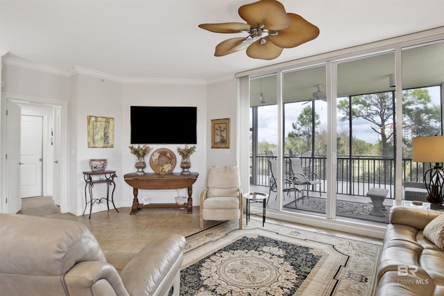 living area featuring plenty of natural light, tile patterned floors, and crown molding