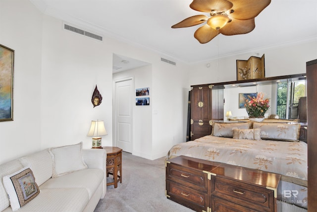 bedroom with ornamental molding, light colored carpet, and visible vents