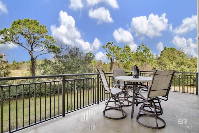 balcony featuring outdoor dining space