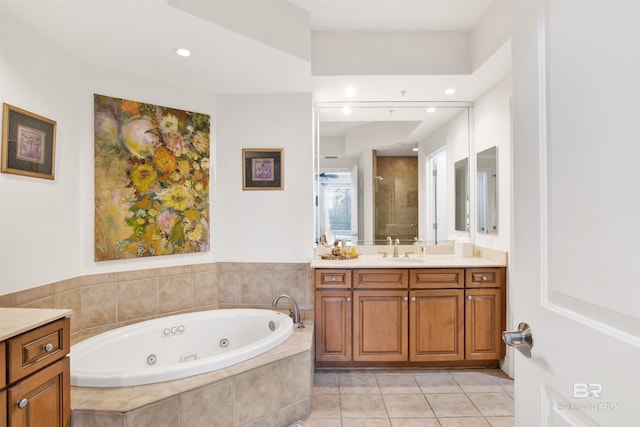 full bathroom featuring recessed lighting, vanity, tile patterned flooring, tiled shower, and a jetted tub