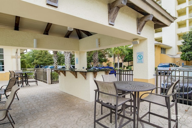 view of patio with a gazebo and outdoor dining space