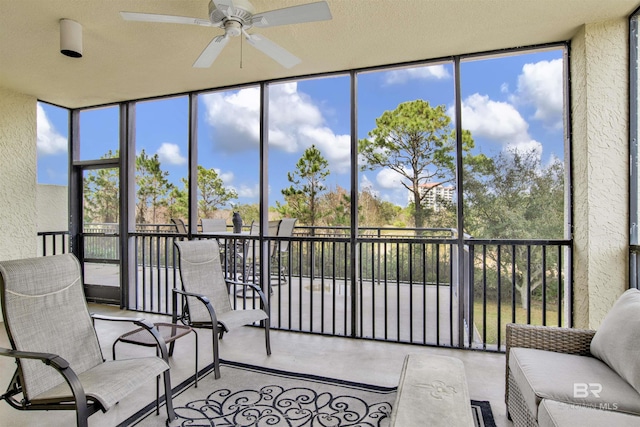 sunroom / solarium with ceiling fan