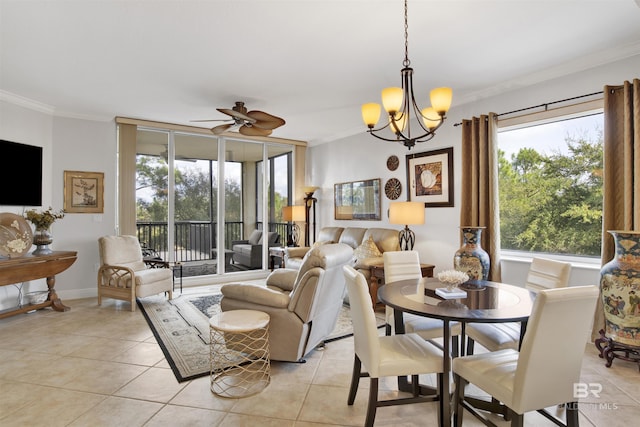 dining space with light tile patterned floors, baseboards, ornamental molding, and ceiling fan with notable chandelier