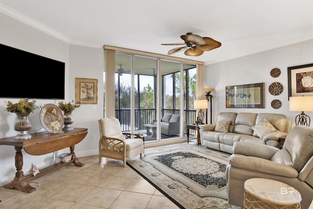 living room with ceiling fan, crown molding, baseboards, and light tile patterned floors