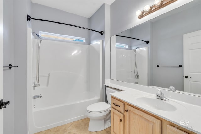 full bathroom with toilet, vanity, tile patterned flooring, and bathing tub / shower combination