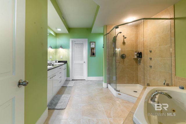 bathroom featuring independent shower and bath, vanity, and tile floors