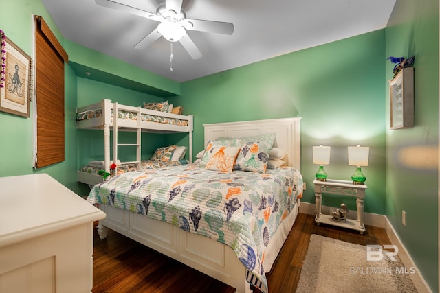 bedroom featuring ceiling fan and dark hardwood / wood-style flooring