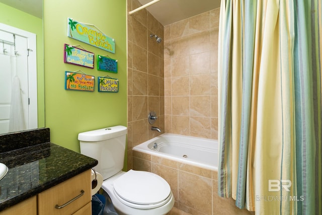 full bathroom with vanity with extensive cabinet space, toilet, and shower / bath combo with shower curtain