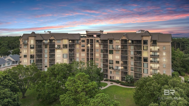 view of outdoor building at dusk