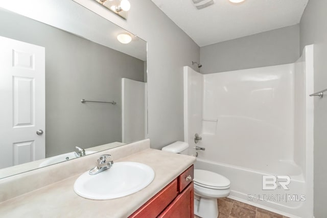 full bathroom with vanity, toilet, and washtub / shower combination