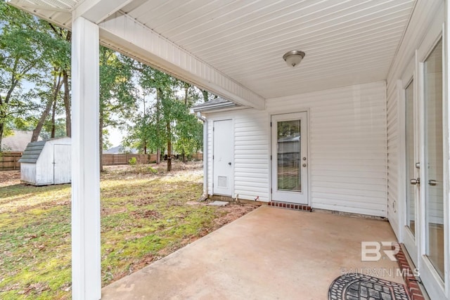 view of patio / terrace with a shed