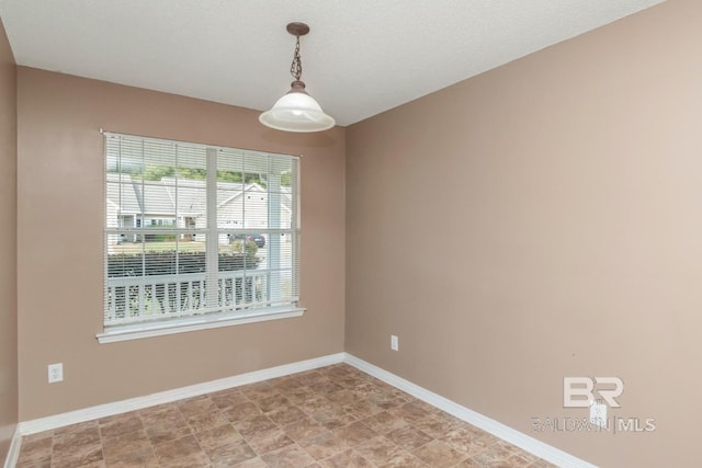 spare room with a wealth of natural light