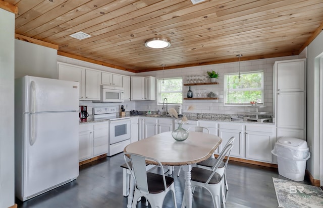 kitchen with white appliances, sink, decorative light fixtures, white cabinetry, and wood ceiling