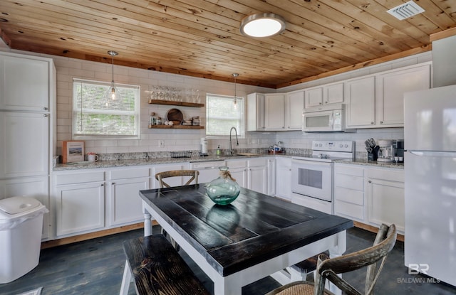 kitchen with wood ceiling, decorative light fixtures, and white appliances
