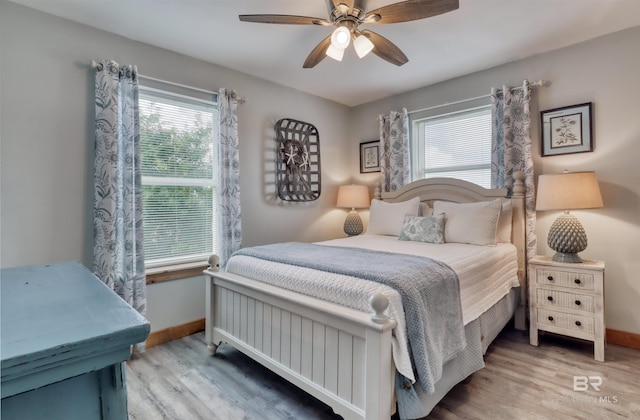 bedroom with hardwood / wood-style flooring and ceiling fan