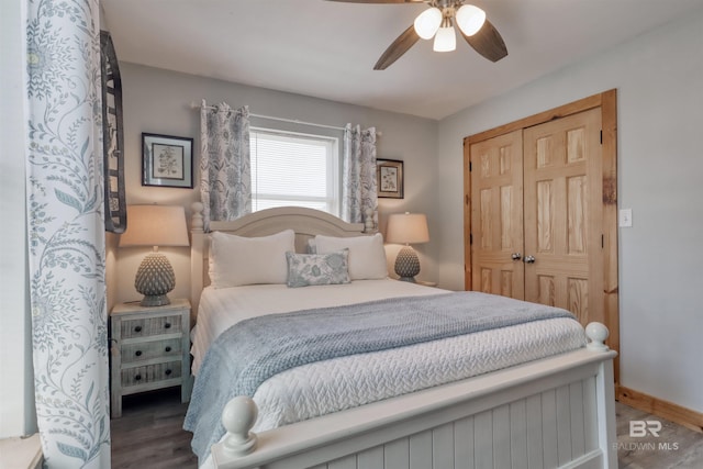 bedroom featuring hardwood / wood-style floors, ceiling fan, and a closet