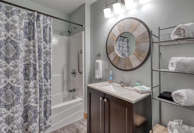 bathroom featuring hardwood / wood-style floors, vanity, and shower / tub combo with curtain