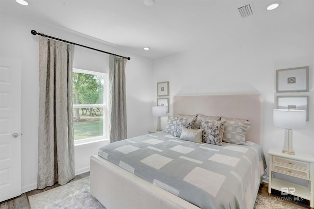 bedroom with hardwood / wood-style floors