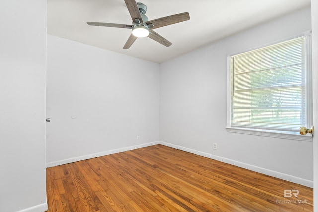 4014 Moffett Ct, Mobile, AL 36618 - spare room with wood finished floors, ceiling fan, and baseboards