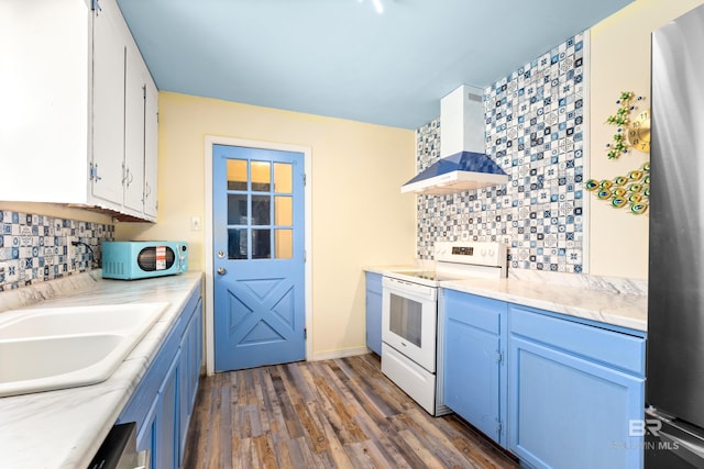 4014 Moffett Ct, Mobile, AL 36618 - kitchen with white appliances, tasteful backsplash, blue cabinetry, and dark wood-style floors