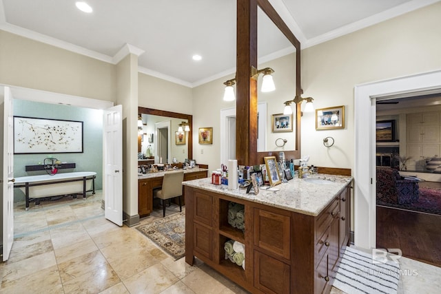 bathroom featuring ornamental molding, vanity, and recessed lighting