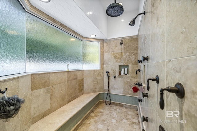 bathroom with a tile shower