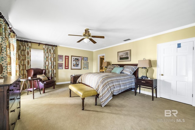 bedroom featuring ornamental molding, carpet, visible vents, and baseboards