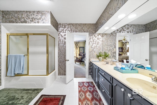 full bath with double vanity, a sink, ensuite bath, tile patterned flooring, and wallpapered walls