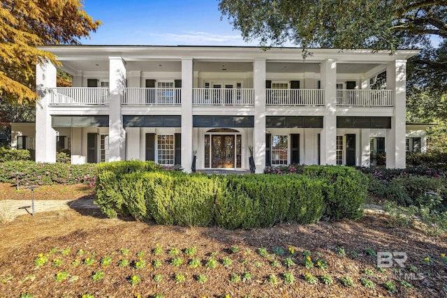 view of front of property featuring a balcony