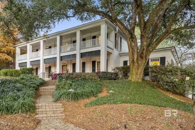 view of front of house featuring a balcony