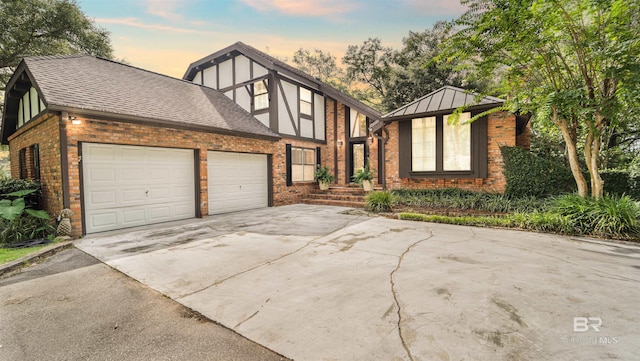 tudor home featuring a garage