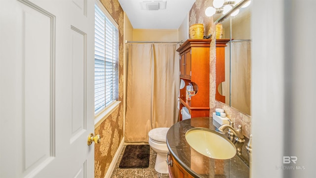 bathroom with tile patterned floors, vanity, and toilet