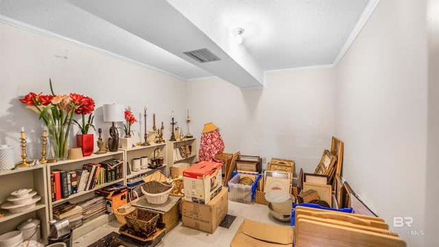 interior space with light tile patterned floors and crown molding