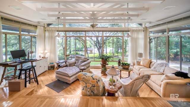 sunroom with ceiling fan and a wealth of natural light