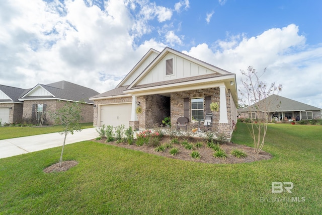 craftsman inspired home with a garage and a front lawn