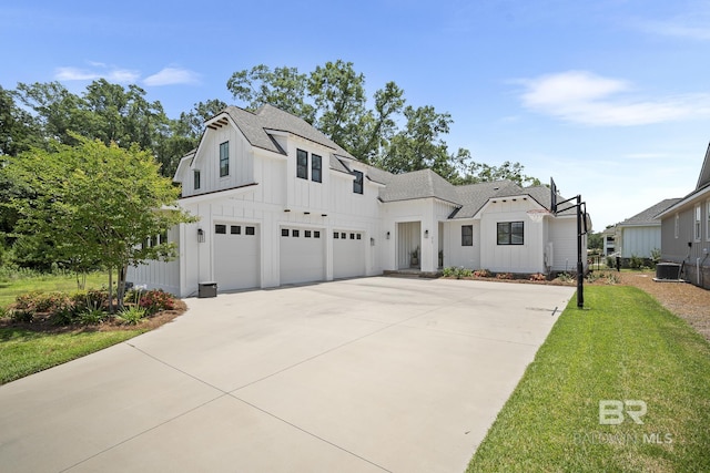 313 Cuban Lily Dr, Fairhope, AL 36532 - modern farmhouse featuring board and batten siding, driveway, a shingled roof, a garage, and cooling unit